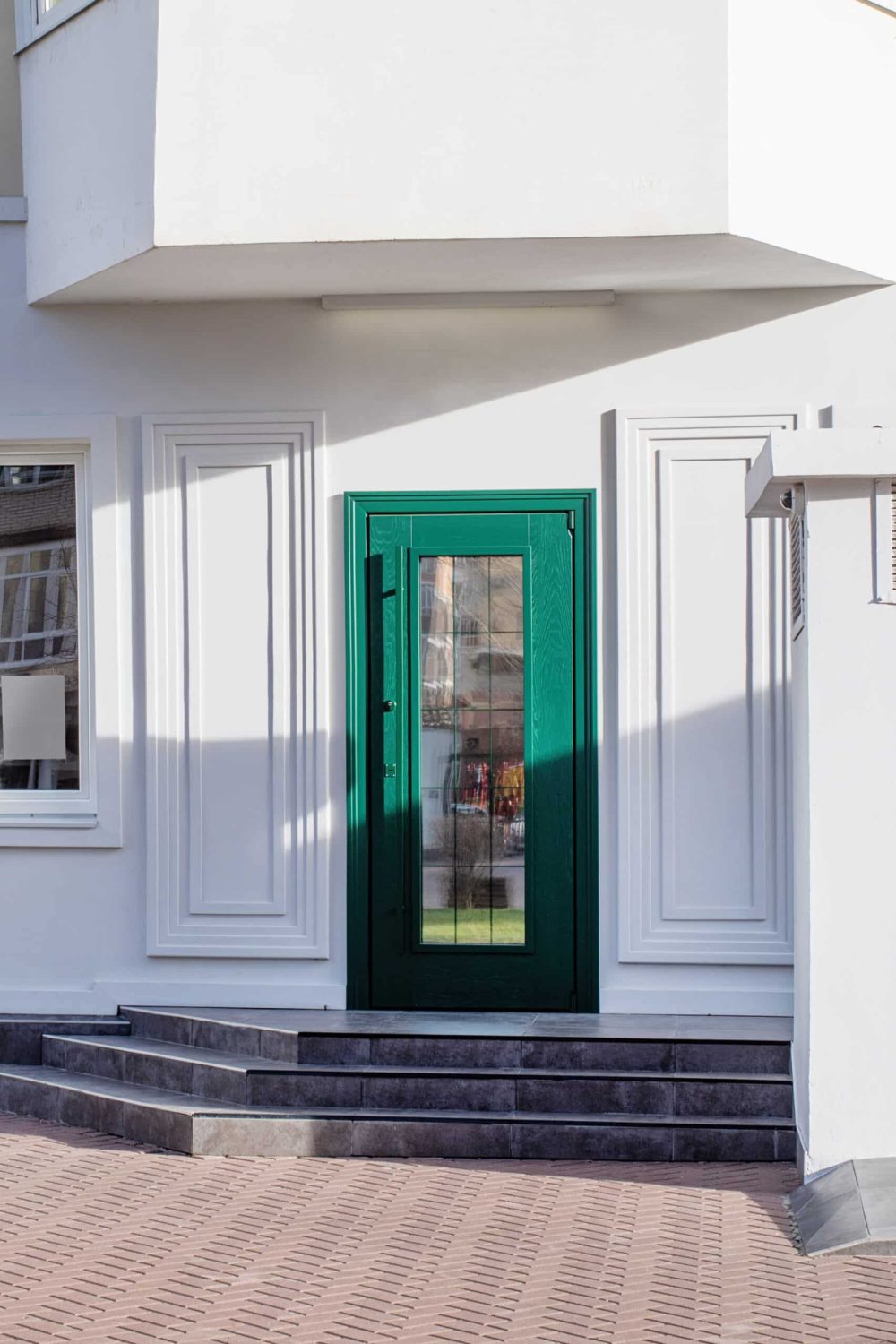 establishment exterior with white walls and green door, mockup design, shadow overlay